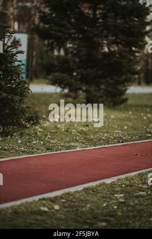 Closeup of a running track in the autumn pa Stock Photo