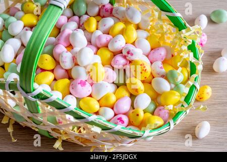 Easter. Basket filled with small sugar eggs Stock Photo