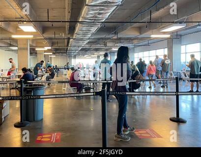 Frisco TX, USA - March 26, 2021: Indoor view of people waiting in lines to get the COVID-19 vaccine Stock Photo