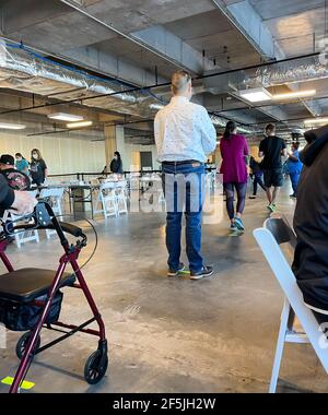 Frisco TX, USA - March 26, 2021: Indoor view of people waiting in lines to get the COVID-19 vaccine Stock Photo