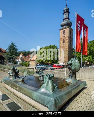 wine fountain at Bad Bergzabern on the German Wine Route is metaphorically pointing out the virtues and vices of wine drinking, Rhineland-Palatinate, Stock Photo