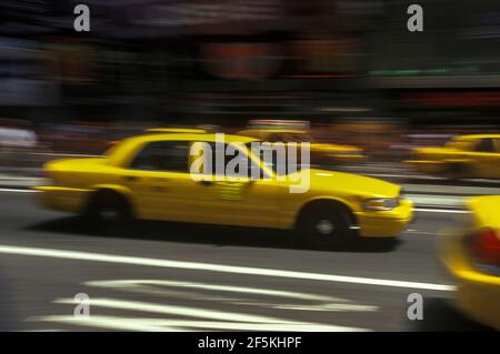 2003 HISTORICAL STREET SCENE YELLOW TAXI CABS (©FORD MOTOR CO 2000) TIMES SQUARE MANHATTAN NEW YORK CITY USA Stock Photo