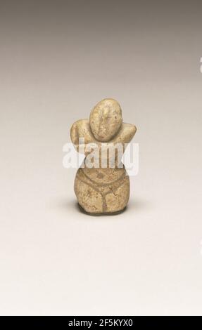 Fragmentary Neolithic standing female figurine. Unknown Stock Photo