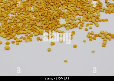 Daal Chana, Heap of yellow split chickpeas isolated on white background, top view Stock Photo