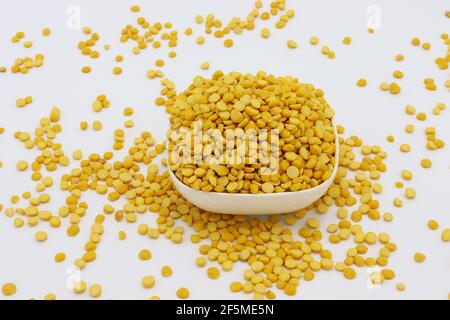 chickpea Also Know as Chana Daal in a white white little bowl isolated on white background Stock Photo