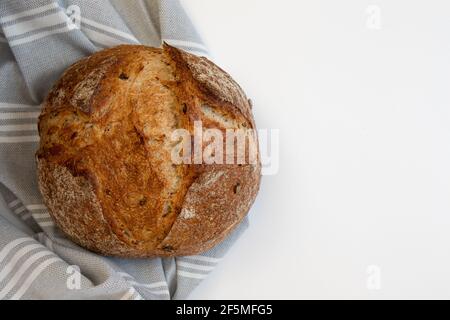 Fresh bread with gray tablecloth on white background.Top view Stock Photo