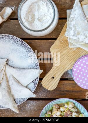Making Chinese dumplings (wonton). Stock Photo