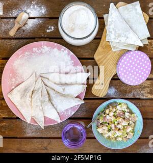Making Chinese dumplings (wonton). Stock Photo