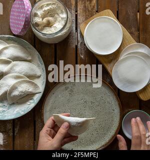 Making Chinese dumplings (wonton). Stock Photo