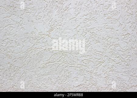 Rough white concrete wall. Small cracks on the surface. Background texture Stock Photo