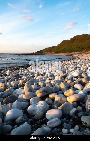 Beach with white round stones, Glenburn, Wairarapa, North Island, New Zealand Stock Photo