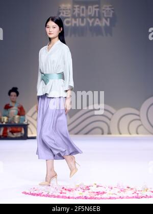 Beijing, China. 27th Mar, 2021. A model presents a creation by Chu Yan during the China Fashion Week in Beijing, capital of China, March 27, 2021. Credit: Chen Jianli/Xinhua/Alamy Live News Stock Photo