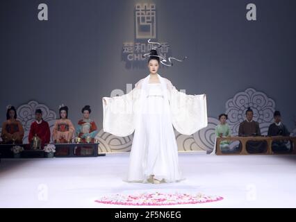 Beijing, China. 27th Mar, 2021. A model presents a creation by Chu Yan during the China Fashion Week in Beijing, capital of China, March 27, 2021. Credit: Chen Jianli/Xinhua/Alamy Live News Stock Photo