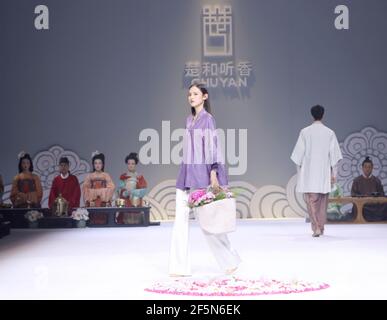 Beijing, China. 27th Mar, 2021. Models present creations by Chu Yan during the China Fashion Week in Beijing, capital of China, March 27, 2021. Credit: Chen Jianli/Xinhua/Alamy Live News Stock Photo