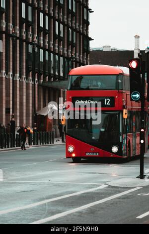 London UK February 2021 Vertical shot of a red double decker bus number 12, going to oxford circus station Stock Photo