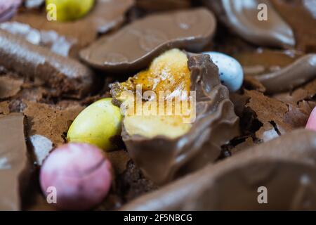 Home baking Easter concept. Brownie with chocolate bars, mini easter eggs and biscuits baked in. Chocolate feast home baked treat Stock Photo