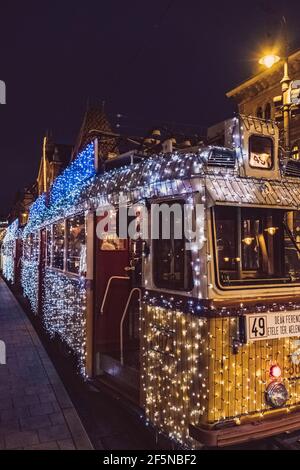 Budapest Christmas Trams illuminated at Night in Central Budapest, Hungary Stock Photo