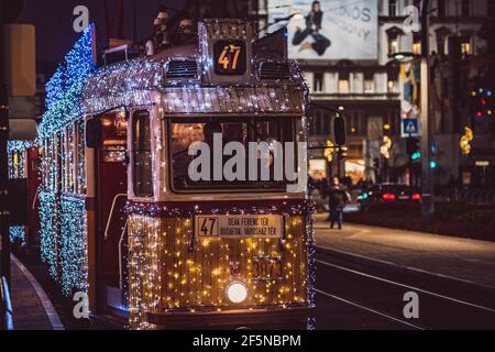Budapest Christmas Trams illuminated at Night in Central Budapest, Hungary Stock Photo