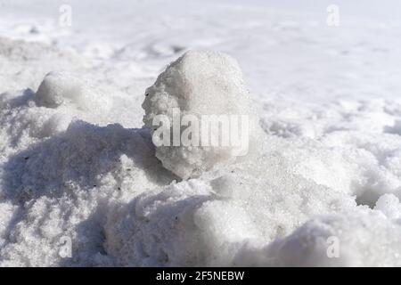 snowball in a snowdrift on a winter sunny day. winter background. Stock Photo
