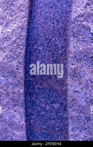 granite surface with a blue tint and a dark longitudinal stripe. stone background Stock Photo