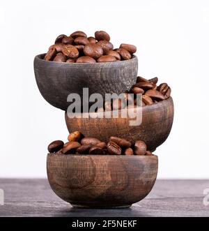 Roasted coffee beans in wooden bowls - Coffea Stock Photo