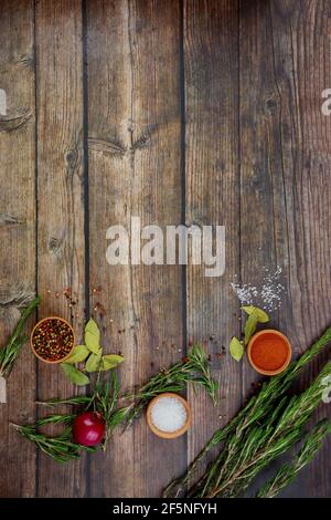 Various herbs and spices on wooden background. Stock Photo