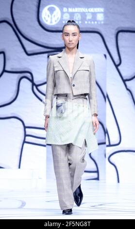 Beijing, China. 27th Mar, 2021. A model presents a creation by Ding Jie during the China Fashion Week in Beijing, capital of China, March 27, 2021. Credit: Chen Jianli/Xinhua/Alamy Live News Stock Photo