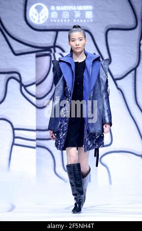 Beijing, China. 27th Mar, 2021. A model presents a creation by Ding Jie during the China Fashion Week in Beijing, capital of China, March 27, 2021. Credit: Chen Jianli/Xinhua/Alamy Live News Stock Photo