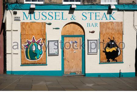 Mussel & Steak bar, West Bow Grassmarket, boarded up and closed due to the Covid-19 Coronavirus lockdown measures, Edinburgh, Scotland Stock Photo