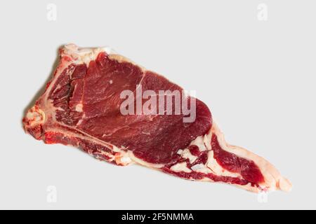 Fresh raw beef steak. Close-up raw rib eye steak isolated on white background with clipping path. Stock Photo