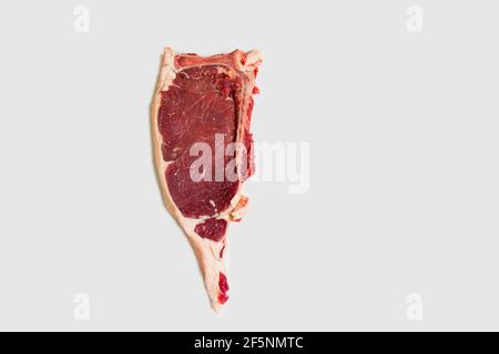 Fresh raw beef steak. Close-up raw rib eye steak isolated on white background with clipping path. Stock Photo