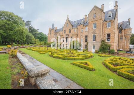 Musselburgh, Scotland - June 5 2019: Landscaped gardens and manor home of historic 15th century Carberry Tower Mansion House in Musselburgh, Scotland Stock Photo