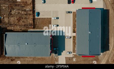 Top view from drone. New tin roof on the apartment building. Waterproof roofing system Stock Photo