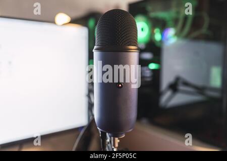 Closeup shot of a professional microphone in home recording studio on a computer screen Stock Photo