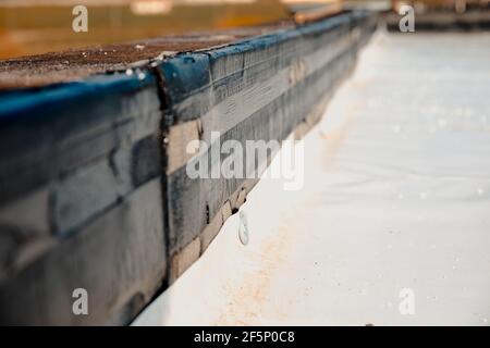 Bituminous vapor barrier mounted on the attic, support layer for synthetic PVC membrane Stock Photo