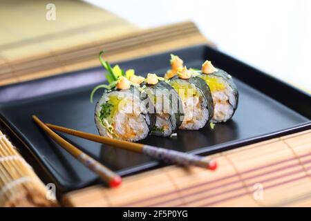 colorful and interesting sushi rolls served in an appetizing way