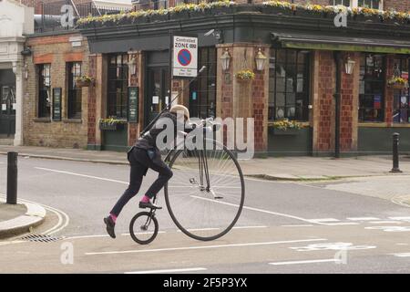 London UK. 27th Mar 2021. Jeremy Vine Remounts Penny Farthing in