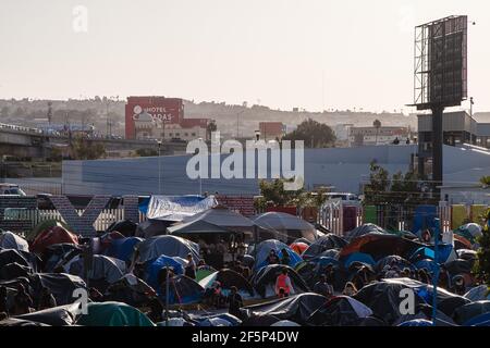 Tijuana, Mexico. 27th Mar, 2021. Hundreds of asylum seekers have set up tents by the port of entry at El Chaparral plaza in Tijuana, Mexico on Friday, March 26, 2021. Photo by Ariana Drehsler/UPI Credit: UPI/Alamy Live News Stock Photo