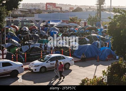 Tijuana, Mexico. 27th Mar, 2021. Hundreds of asylum seekers have set up tents by the port of entry at El Chaparral plaza in Tijuana, Mexico on Friday, March 26, 2021. Photo by Ariana Drehsler/UPI Credit: UPI/Alamy Live News Stock Photo