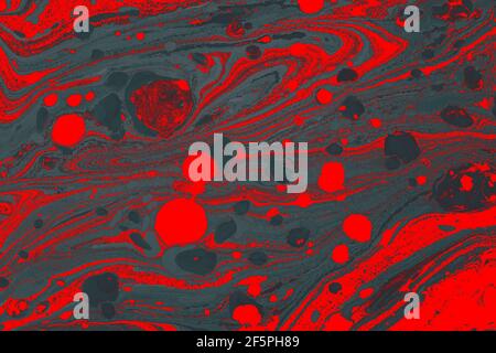 Abstract ebru technique texture with chaotic bubbles in red and dark gray colors Stock Photo