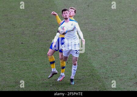 Birkenhead, UK. 27th Mar, 2021. Paul Lewis of Tranmere Rovers shields the ball from George Maris of Mansfield Town. EFL Skybet Football league two match, Tranmere Rovers v Mansfield Town at Prenton Park, Birkenhead, Wirral on Saturday 27th March 2021. this image may only be used for Editorial purposes. Editorial use only, license required for commercial use. No use in betting, games or a single club/league/player publications.pic by Chris Stading/Andrew Orchard sports photography/Alamy Live News Credit: Andrew Orchard sports photography/Alamy Live News Stock Photo