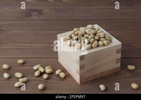 parched soy beans isolated on wooden table Stock Photo