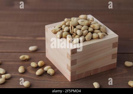 parched soy beans isolated on wooden table Stock Photo
