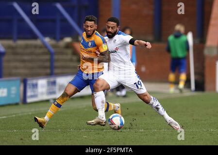 Birkenhead, UK. 27th Mar, 2021. Kellan Gordon of Mansfield Town (l) and Liam Feeney of Tranmere Rovers battle for the ball. EFL Skybet Football league two match, Tranmere Rovers v Mansfield Town at Prenton Park, Birkenhead, Wirral on Saturday 27th March 2021. this image may only be used for Editorial purposes. Editorial use only, license required for commercial use. No use in betting, games or a single club/league/player publications.pic by Chris Stading/Andrew Orchard sports photography/Alamy Live News Credit: Andrew Orchard sports photography/Alamy Live News Stock Photo