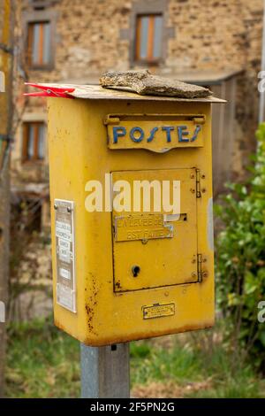 Old french metal postbox in countryside, Puy de Dome department, Auvergne, France Stock Photo