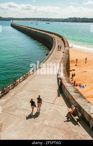 Big pier, looking down over the snaking boardwalk at Saint-Malo, France on a sunny day Stock Photo