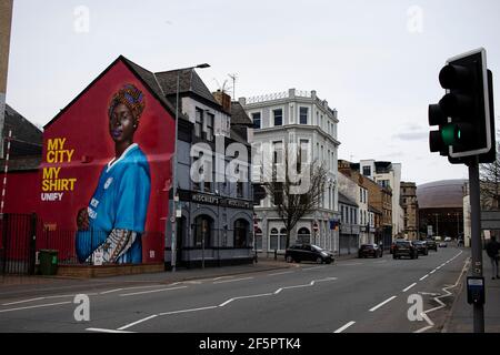 Cardiff, UK. 27th Mar, 2021. A Mural by artist Yusuf Ismail of a Pregnant Women in a Cardiff City football Shirt has appeared on the side of Mischiefs Cafe & Bar in Cardiff Bay, Wales pictured on the 27th March 2021. Credit: Lewis Mitchell/Alamy Live News Stock Photo