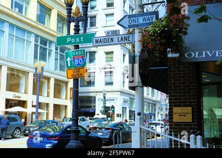 Maiden Lane, Post Street, One Way, and Interstate 80 East street signs; downtown San Francisco, California, near the Union Square shopping district. Stock Photo