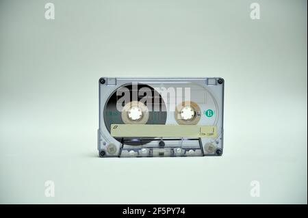 Audio cassette on white surface. Stock Photo