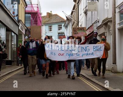 A Kill the bill demonstration and March involving several hundred protesters happens at The Moor square in Falmouth, After speakers finished, a march 1.5 miles through the center of town to Discovery Quay took place for further speeches. The protest in breach of Covid rules was policed at a distance by Devon and Cornwall officers. The proposed Police, crime and sentencing and courts bill could cause serious limitations to protesters deemed to be causing serious disruption. Falmouth. Cornwall, England, 27th March 2021, Credit: Robert Taylor/Alamy Live News Stock Photo